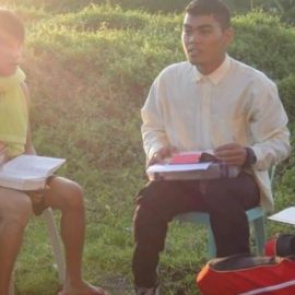 student missionary leading a bible class